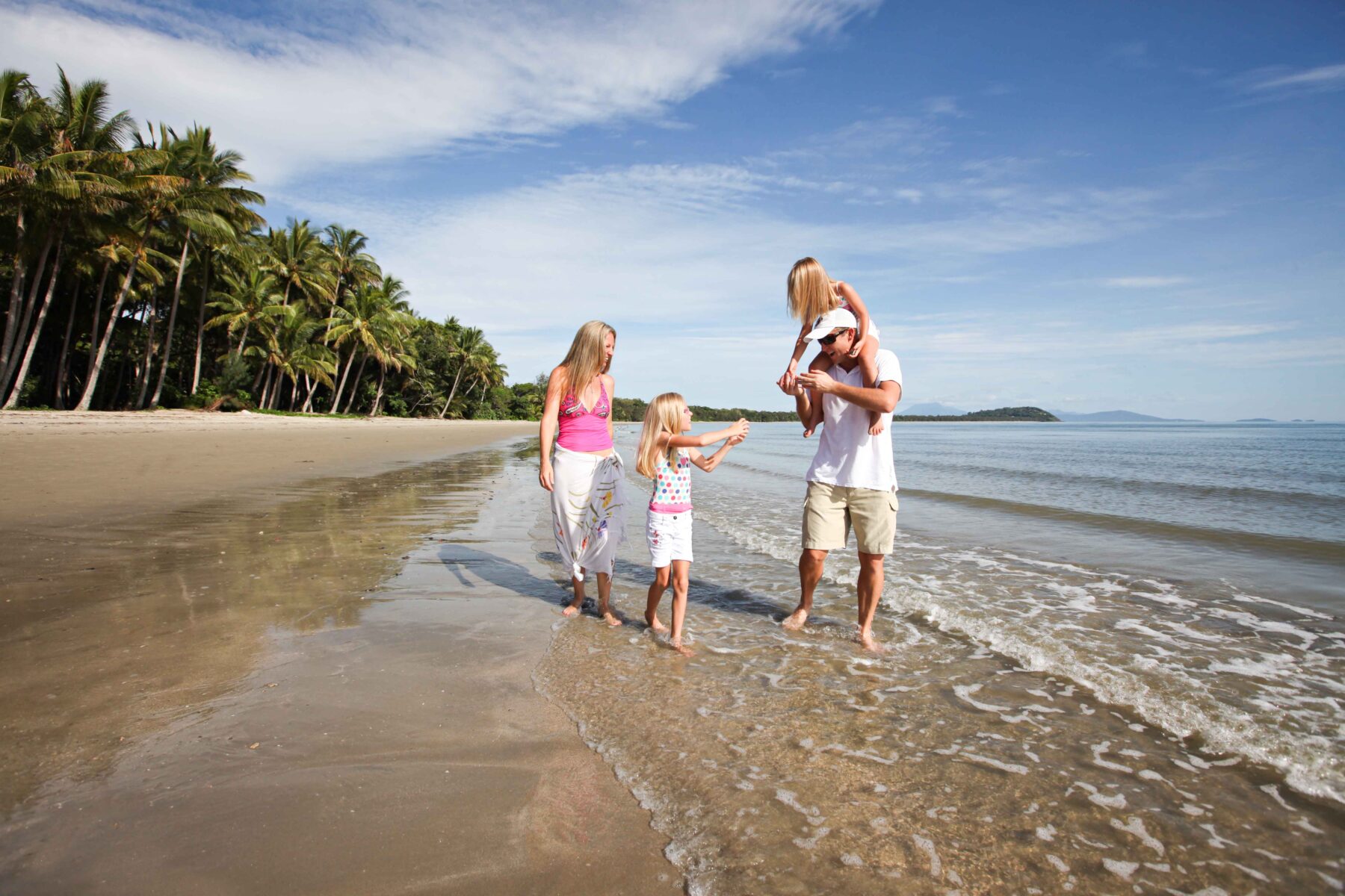 Family Walking on Four Mile Beach in Port Douglas