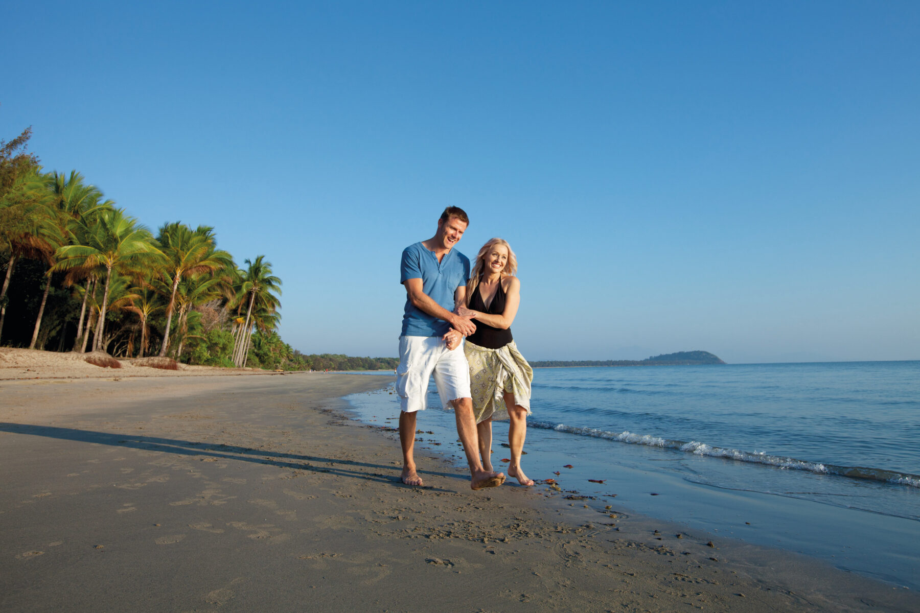 Four Mile Beach Couple Walking Hug