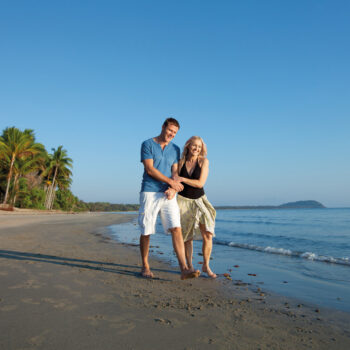 Four Mile Beach Couple Walking Hug